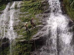 The ladies of Rainforest, River & Reef rappel down a waterfall on course!