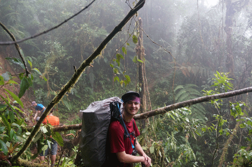 Billy W. hikes through the rainforest.