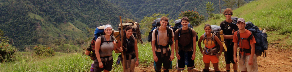 A group of hikers with backpacks in the wilderness