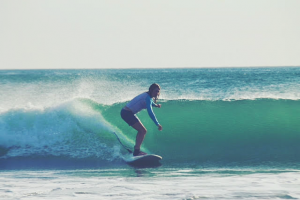 Female instructor surfing