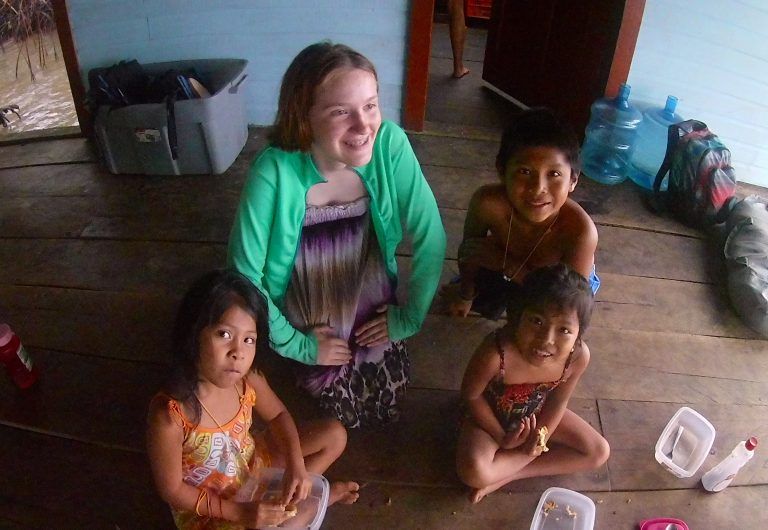 A girl scout sat down with young Costa Rican girls